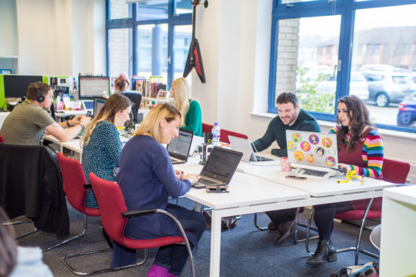 A group of entrepreneurs working and collaborating in coworking space, Welsh ICE.