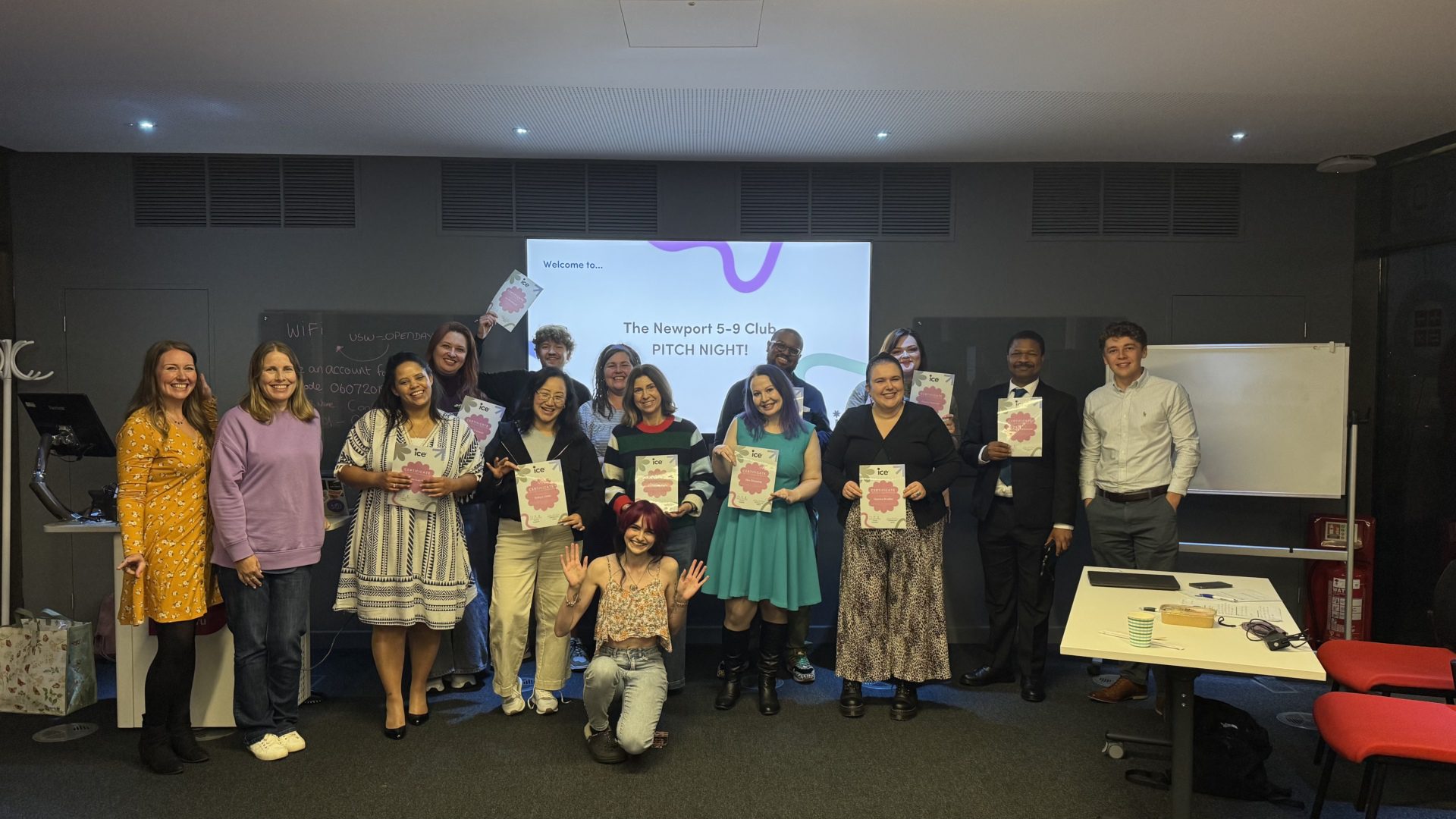 Group of entrepreneurs holding certificates at a "Newport 5-9 Club Pitch Night" event, celebrating business start-up achievements at Welsh ICE.